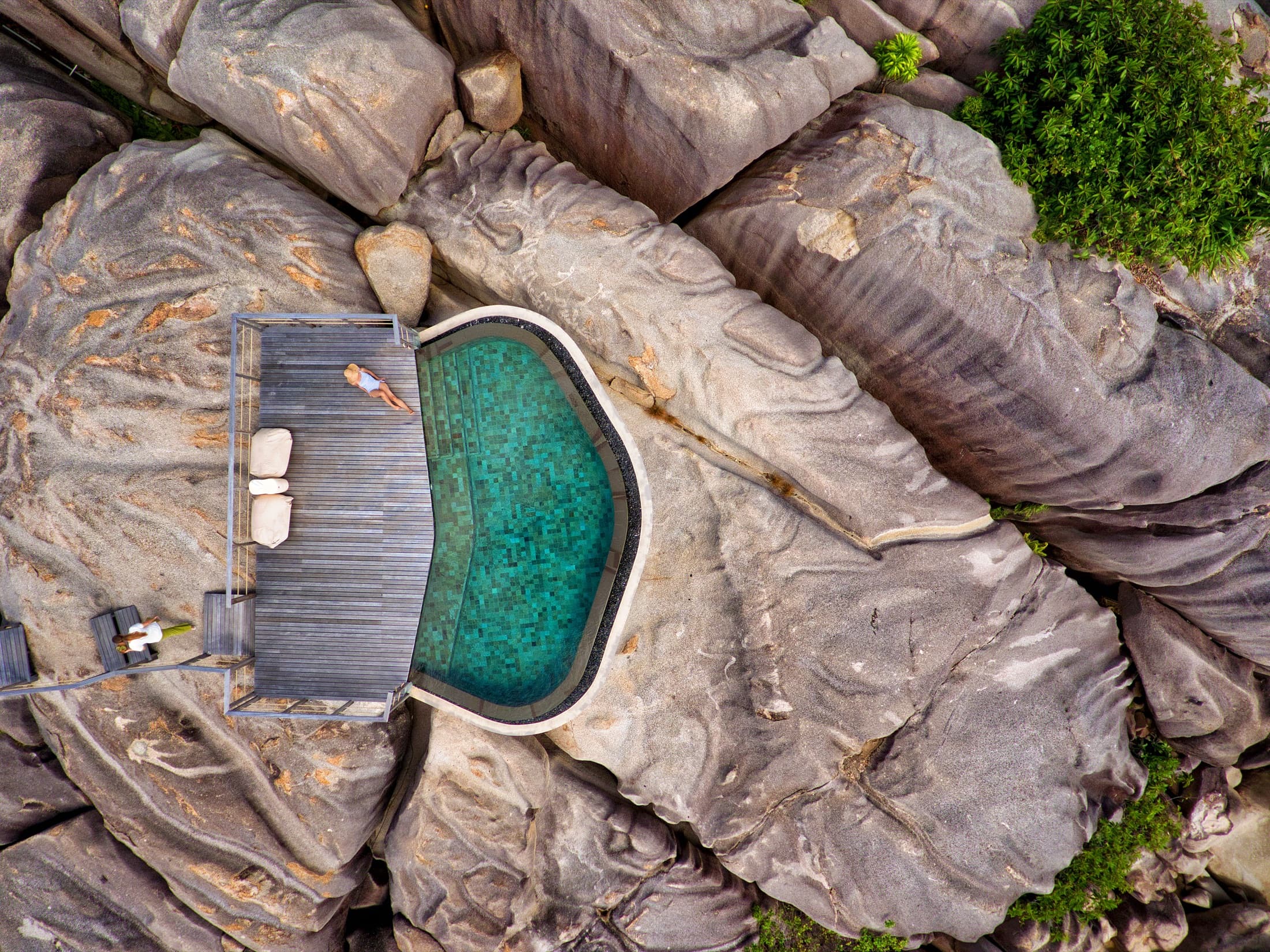 Six Senses Zil Pasyon spa pool on granite rocks from above